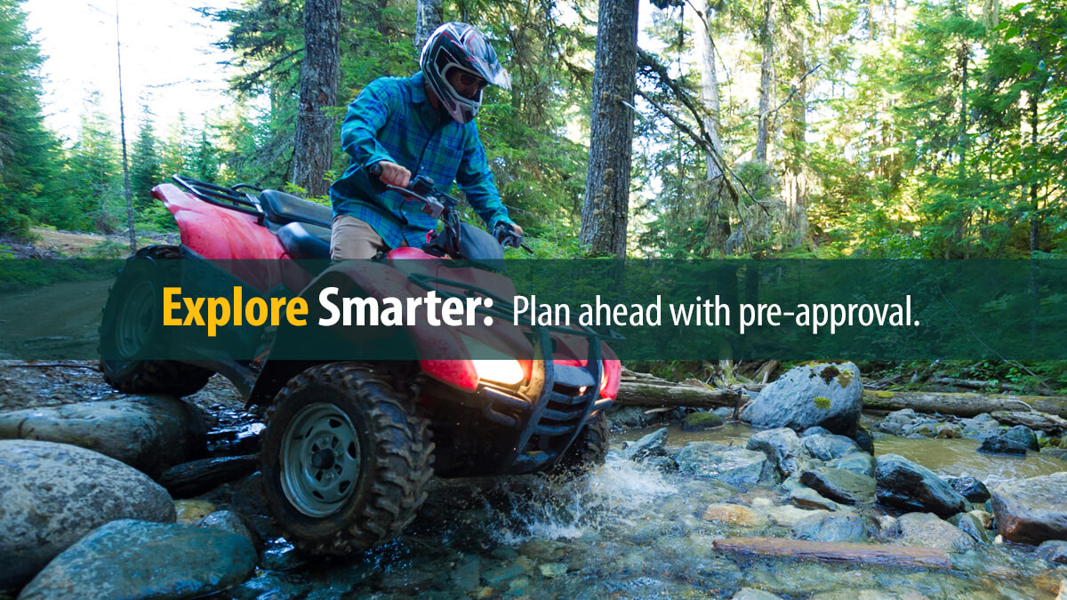 Man enjoying his ATV in the woods.